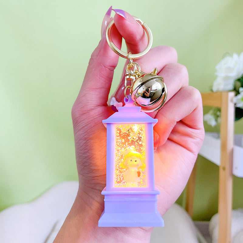 Llavero de faro acrílico al por mayor con luces y aceite para niñas