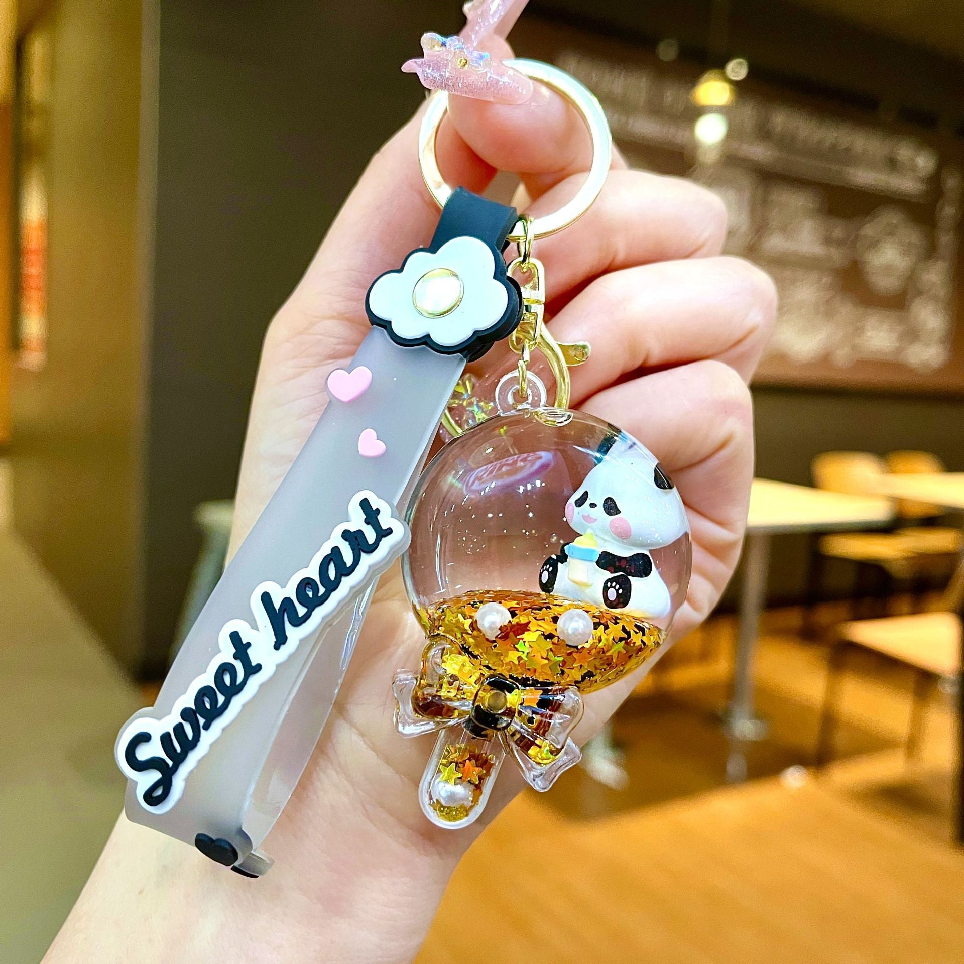 Wholesale Black gold floating cartoon cute panda Liquid Keychains