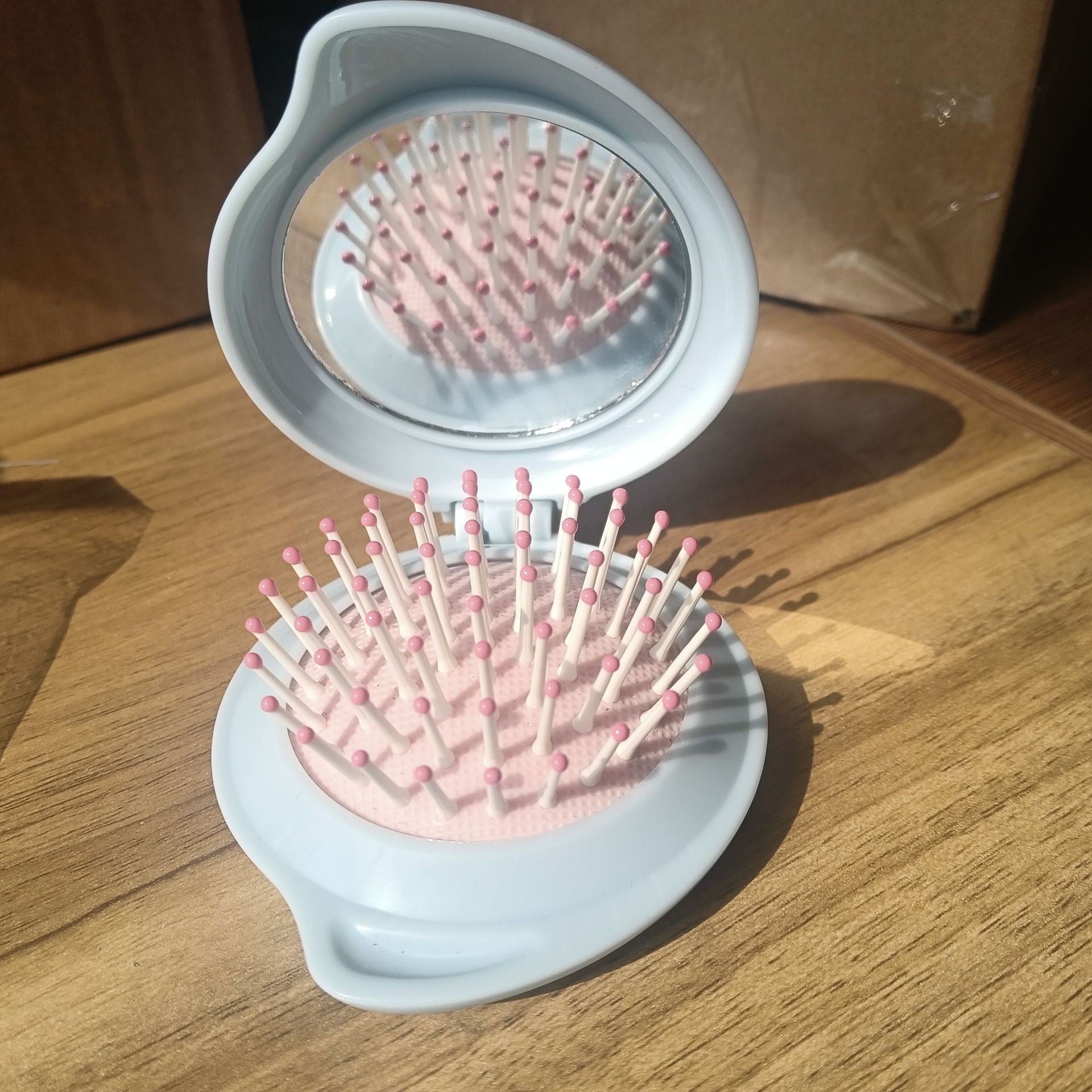 Wholesale ABS Droplet Shaped Cream Gel Folding Mirror Airbag Comb