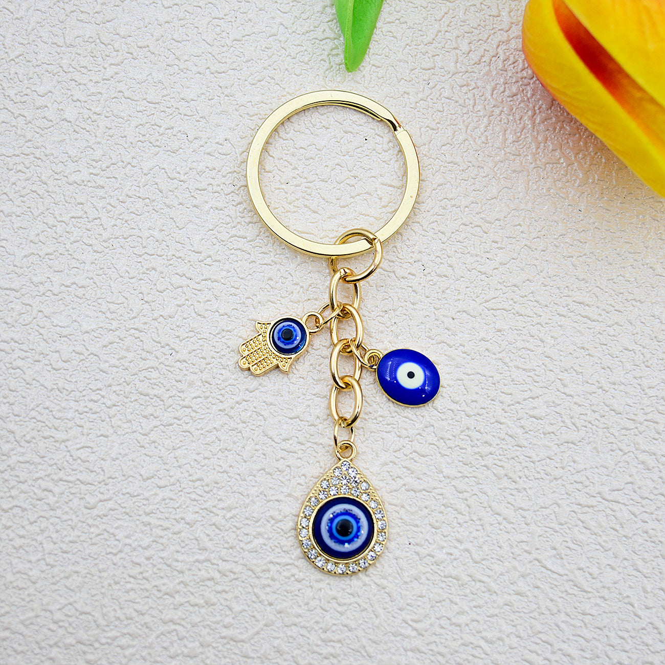 Wholesale Heart-shaped palm water droplet Devil' s eye keychain