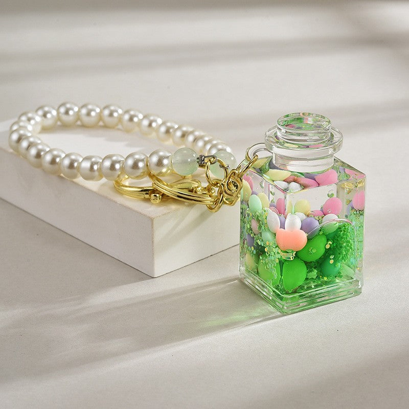 Wholesale Liquid sand bottle with colorful beads in oil bottle pendant acrylic keychain