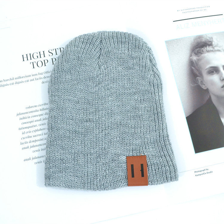 Wholesale Children's Leather Label Warm Ear Protection Knitted Wool Hat
