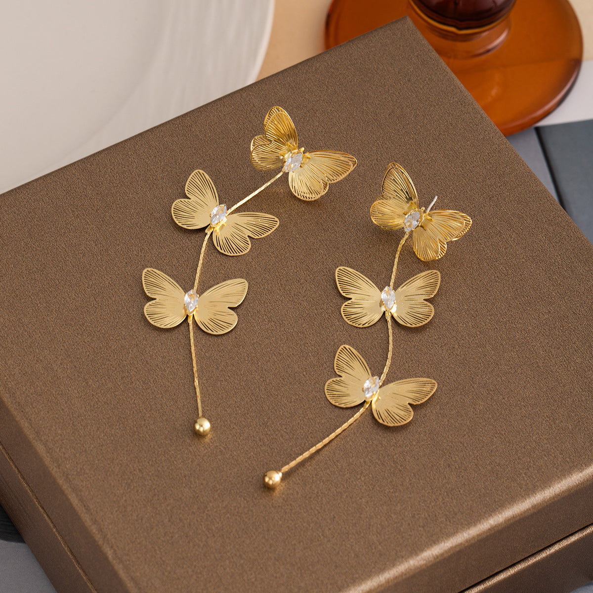 Wholesale Silver Needle Metal Style Three-Dimensional Bow Tassel Earrings