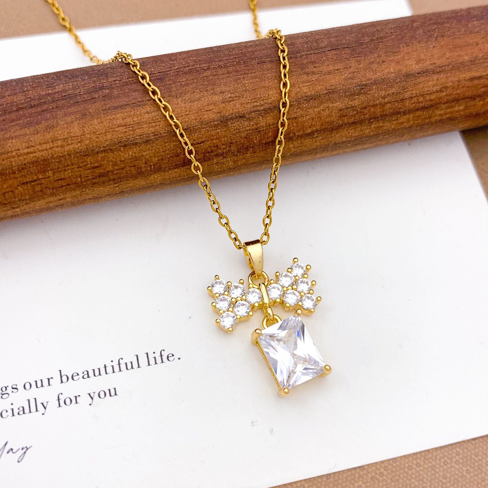 Wholesale Pink heart-shaped bow with diamond studded titanium steel necklace
