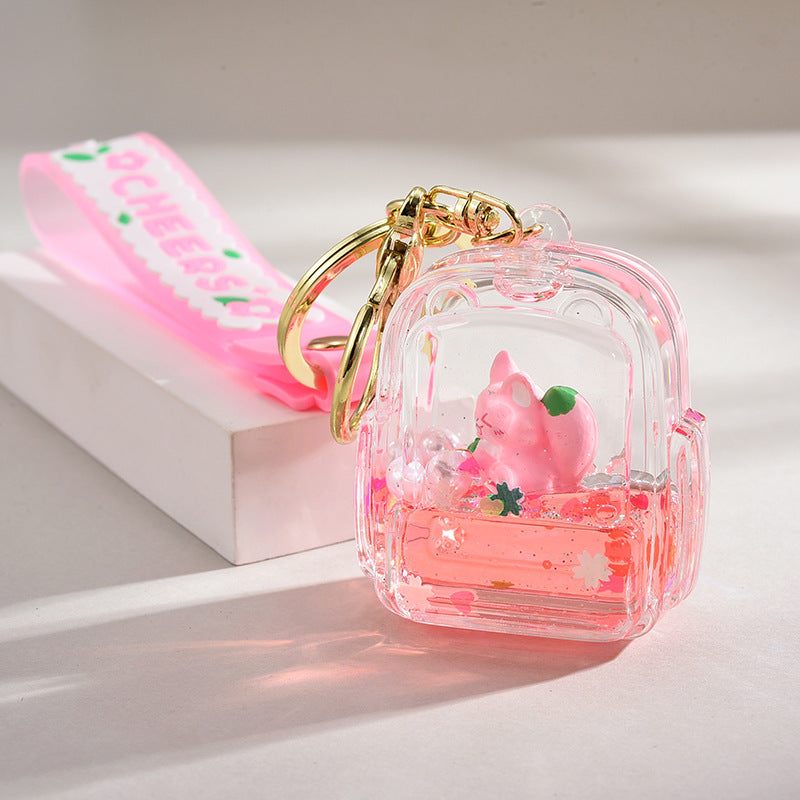 Acrílico al por mayor en la cadena de llave de botella de arena de la logística del flotador de aceite