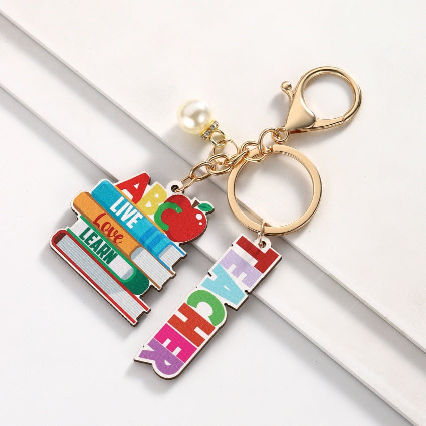 Wholesale Campus style graduation season wooden book keychain