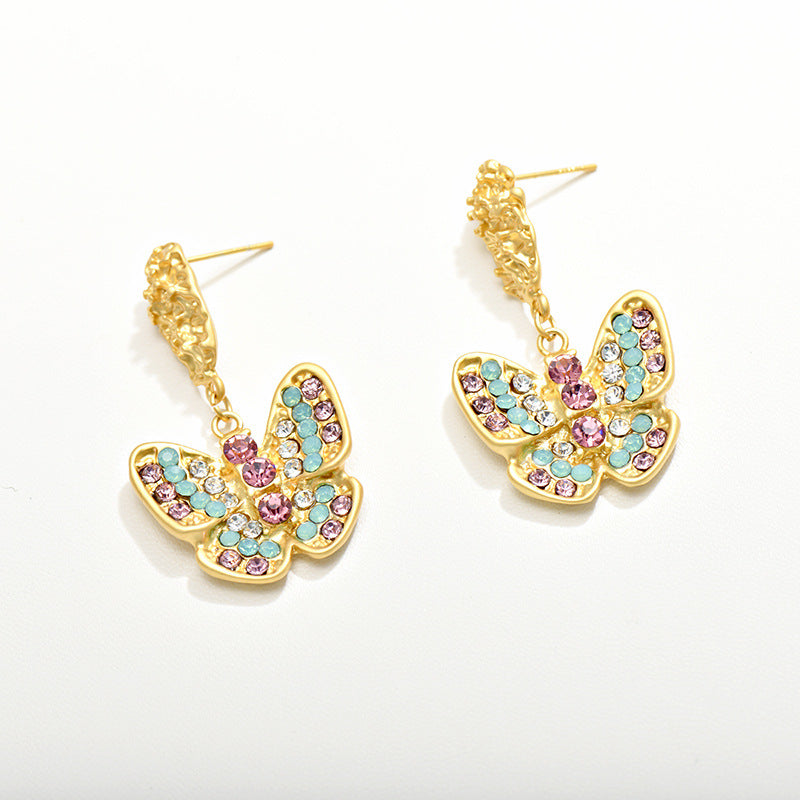 Pendientes de aleación de mariposa de damismo de oro tonto al por mayor