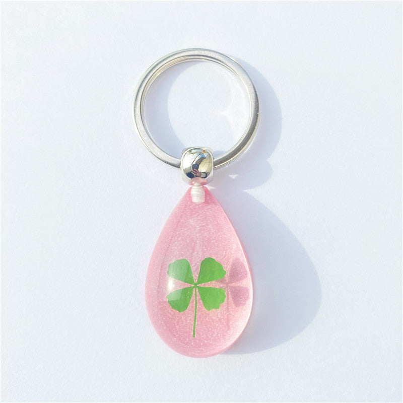 Wholesale 12pcs Four-leaf Clover Luminous Keychain
