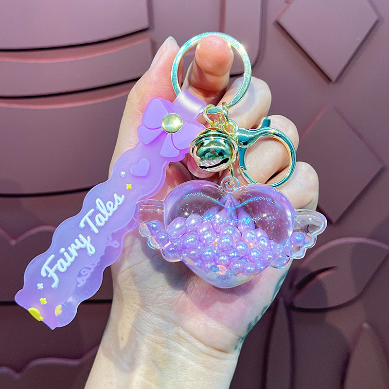 Wholesale Oil-infused Golden Bean Wing Heart Keychain