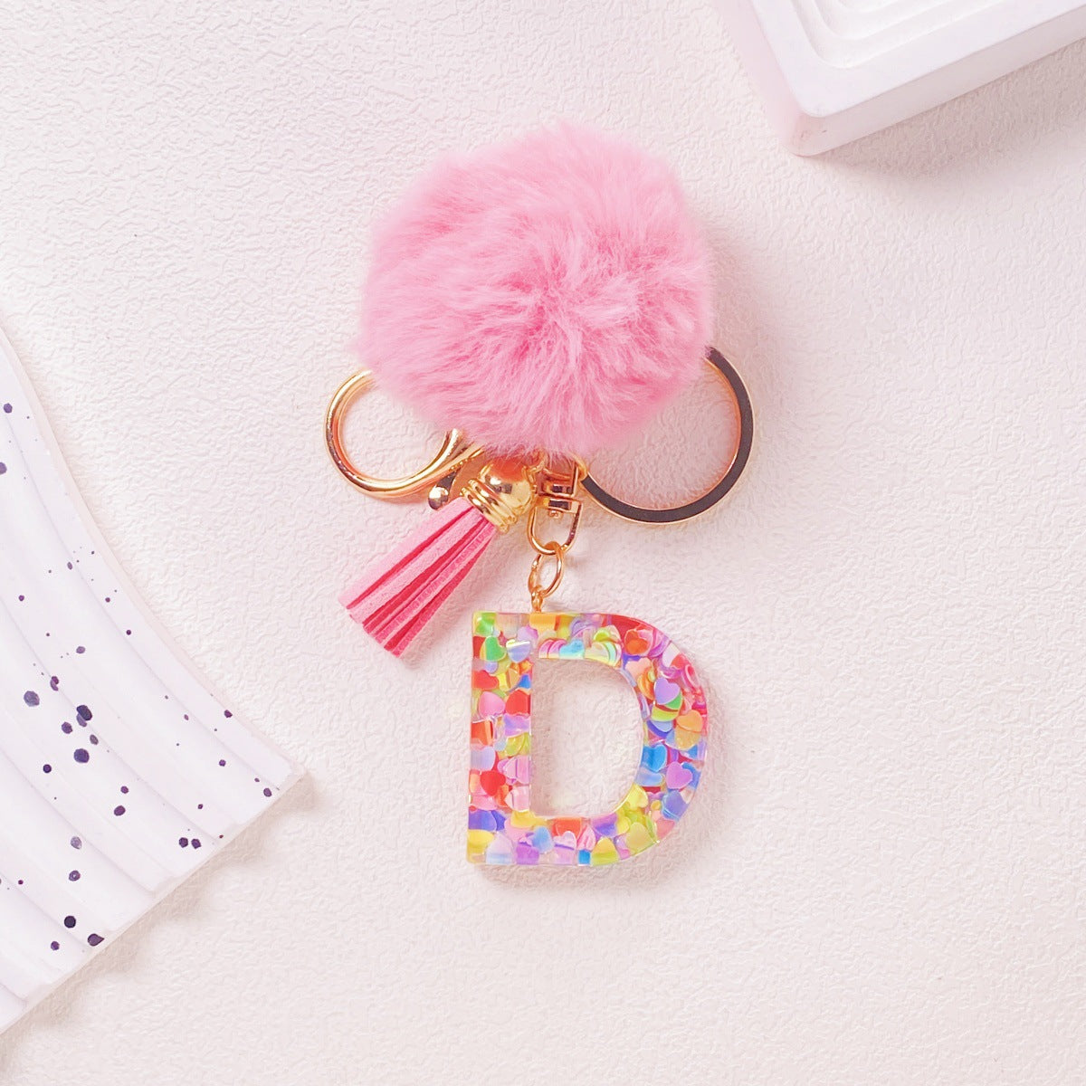 Wholesale Hairball English 26 letter pink Pom Pom keychain