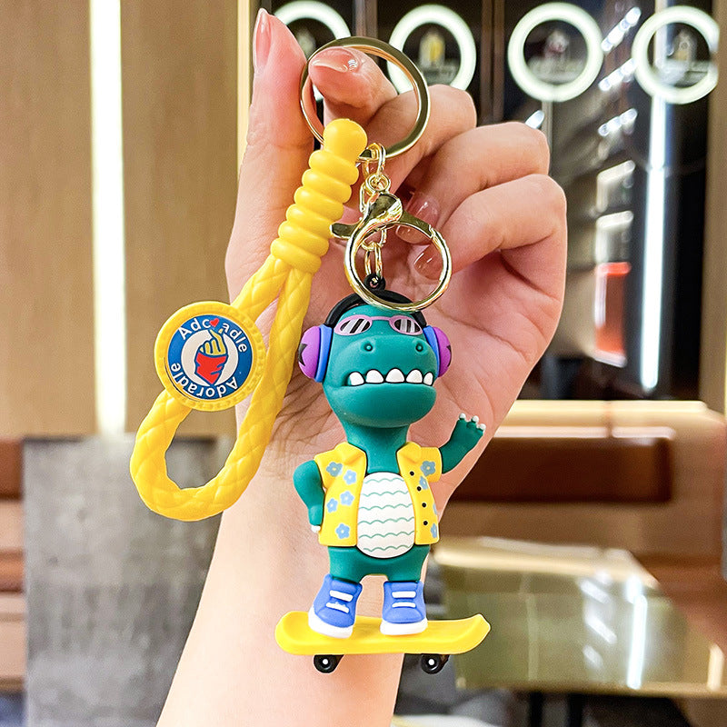Wholesale New Creative Music Skateboard Dinosaur Doll Pvc Keychain