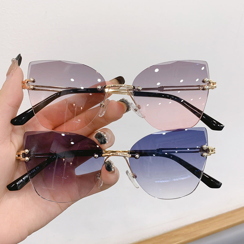 Wholesale Retro frameless cut-edge sunglasses cat-eye gradient sunglasses