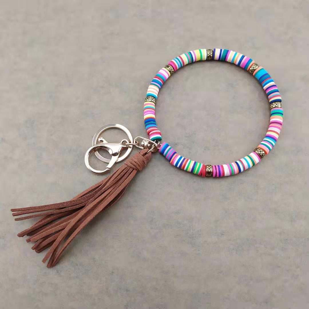 Llavero de muñeca de borla de arcilla colorida al por mayor