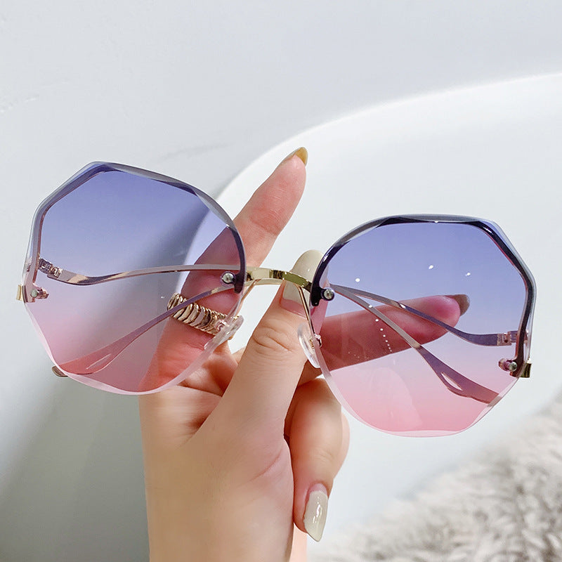Wholesale Large framed rimless trimmed women's sunglasses
