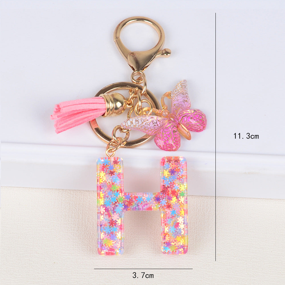 卸売スパンコールスノーフレークレター樹脂キーホルダー