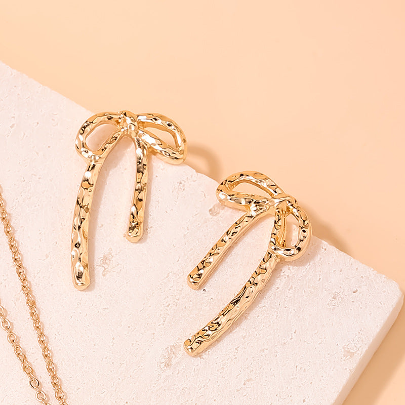 wholesale new INS metal style simple hollow bow earrings