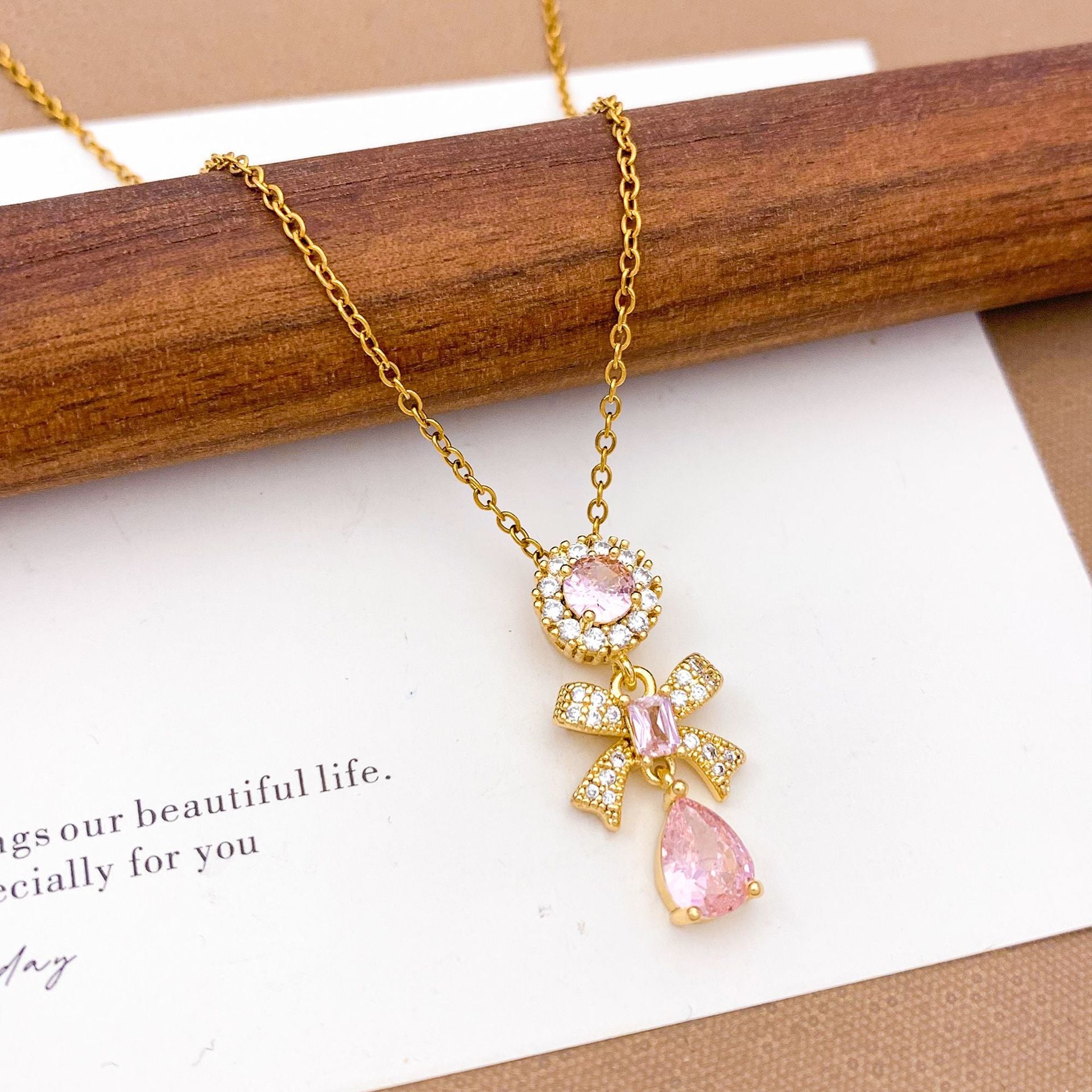 Wholesale Pink heart-shaped bow with diamond studded titanium steel necklace