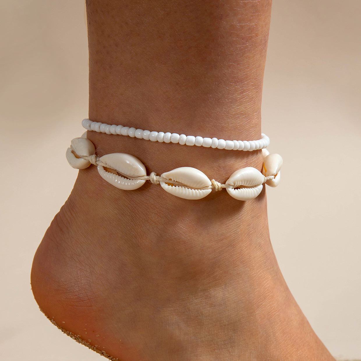 Two pieces of hand-woven anklets from shells