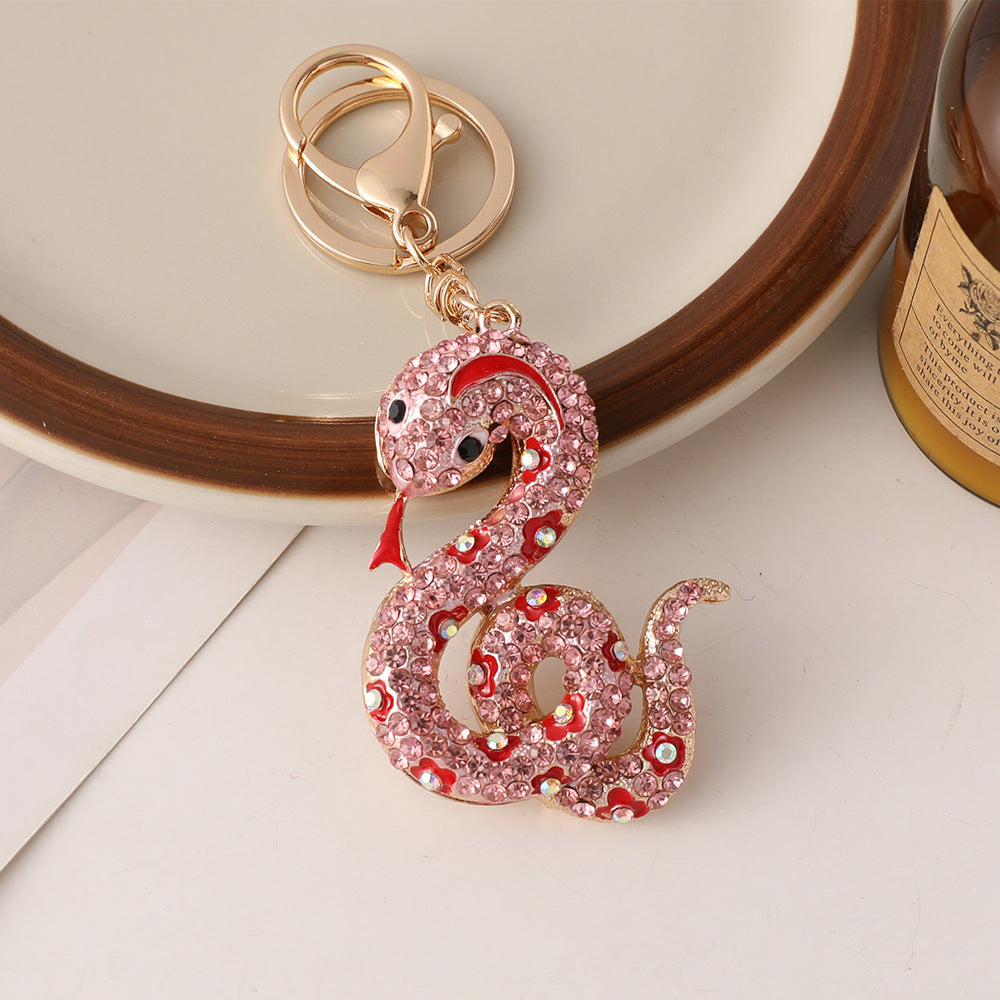 Wholesale Creative cartoon diamond twelve zodiac snake metal car keychain national tide this year pendant small gifts