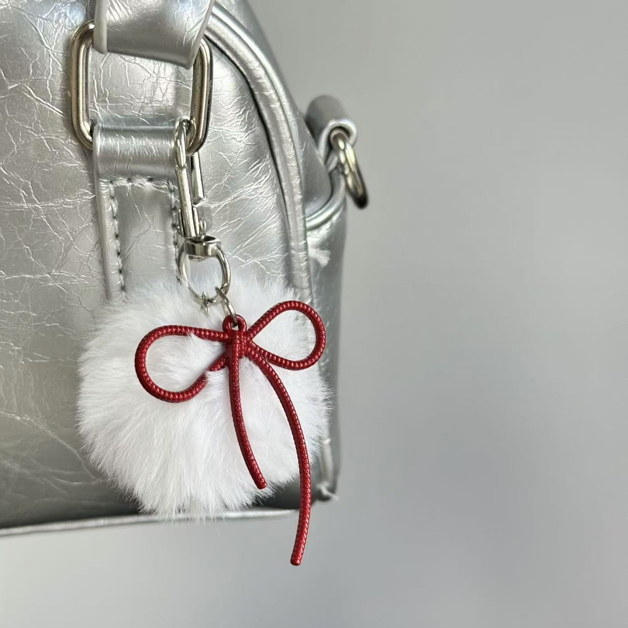Wholesale Retro keychain with small fur ball and bow