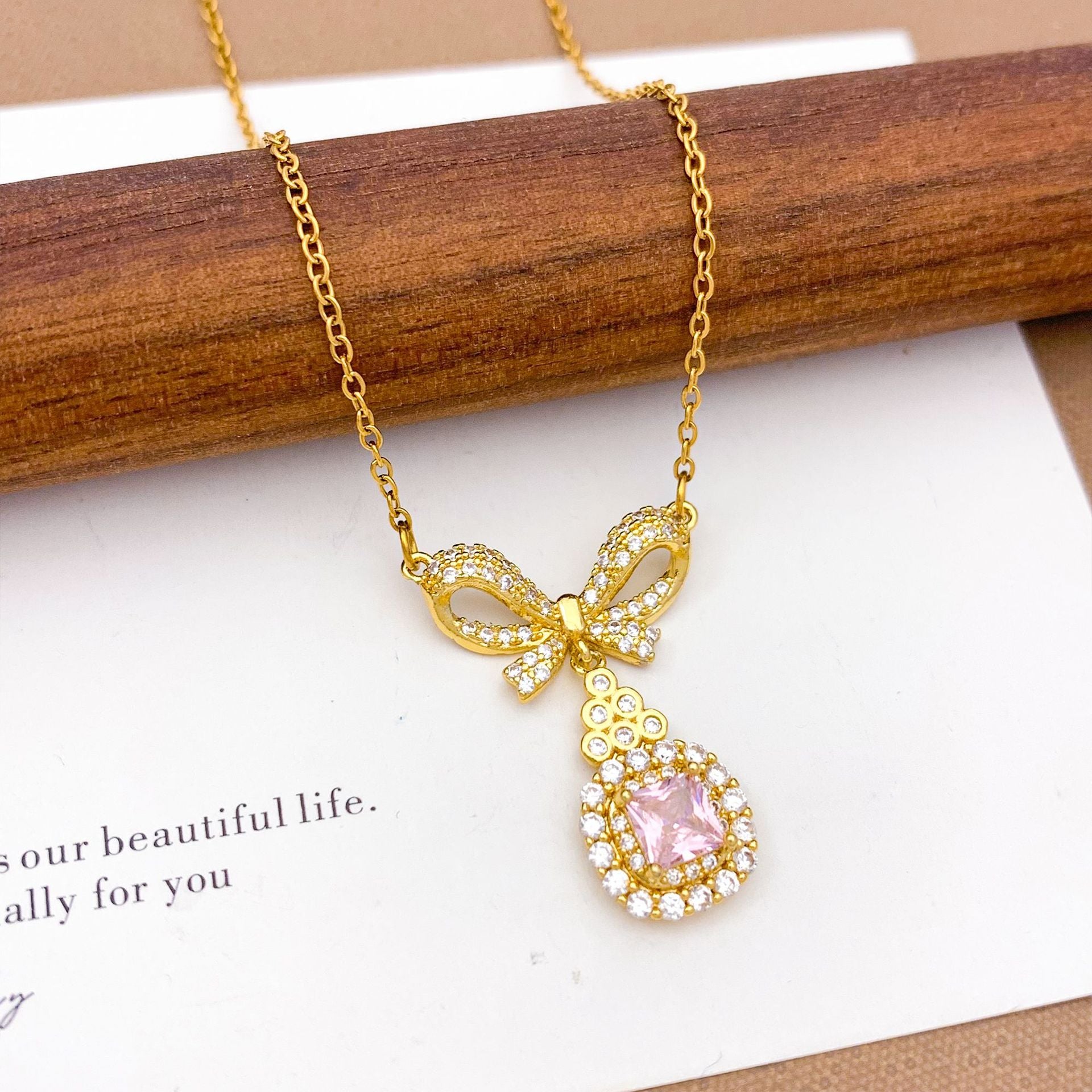 Wholesale Pink heart-shaped bow with diamond studded titanium steel necklace