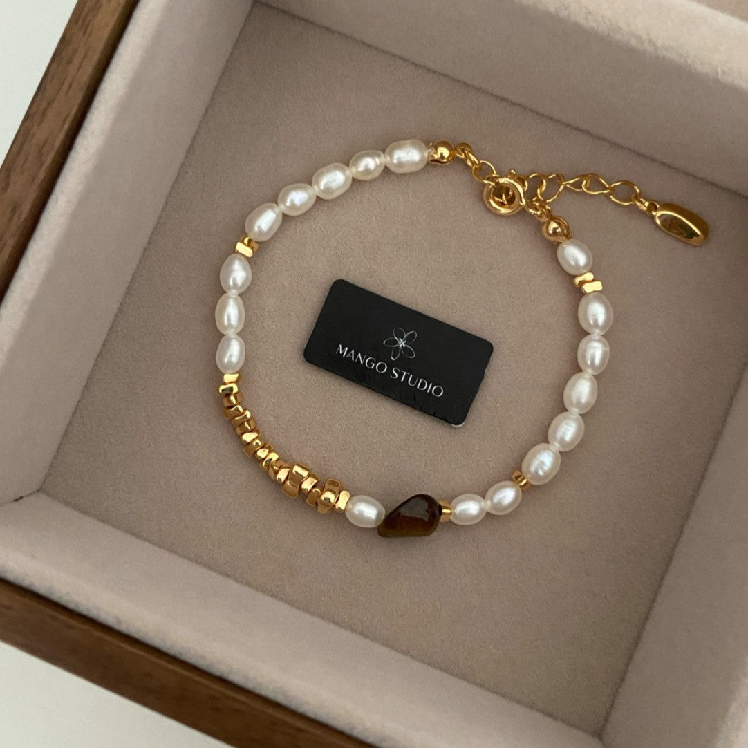 Wholesale Rice-grain pearl tiger eye stone small fresh and high-end adjustable bracelet