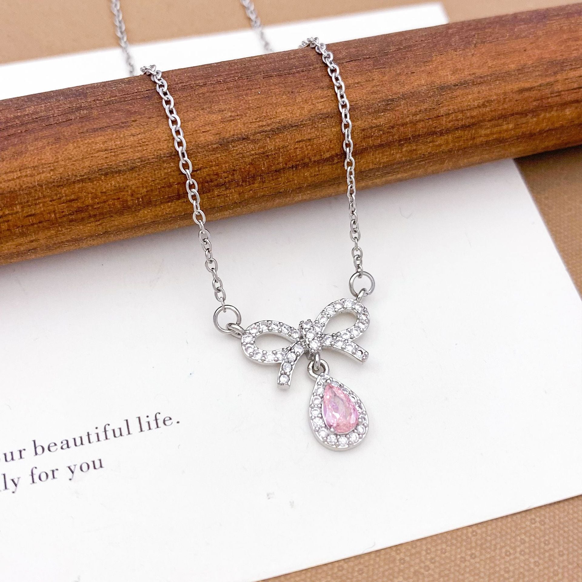 Wholesale Pink heart-shaped bow with diamond studded titanium steel necklace
