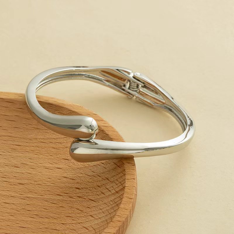Wholesale Golden wide edged wave band exaggerated bracelet