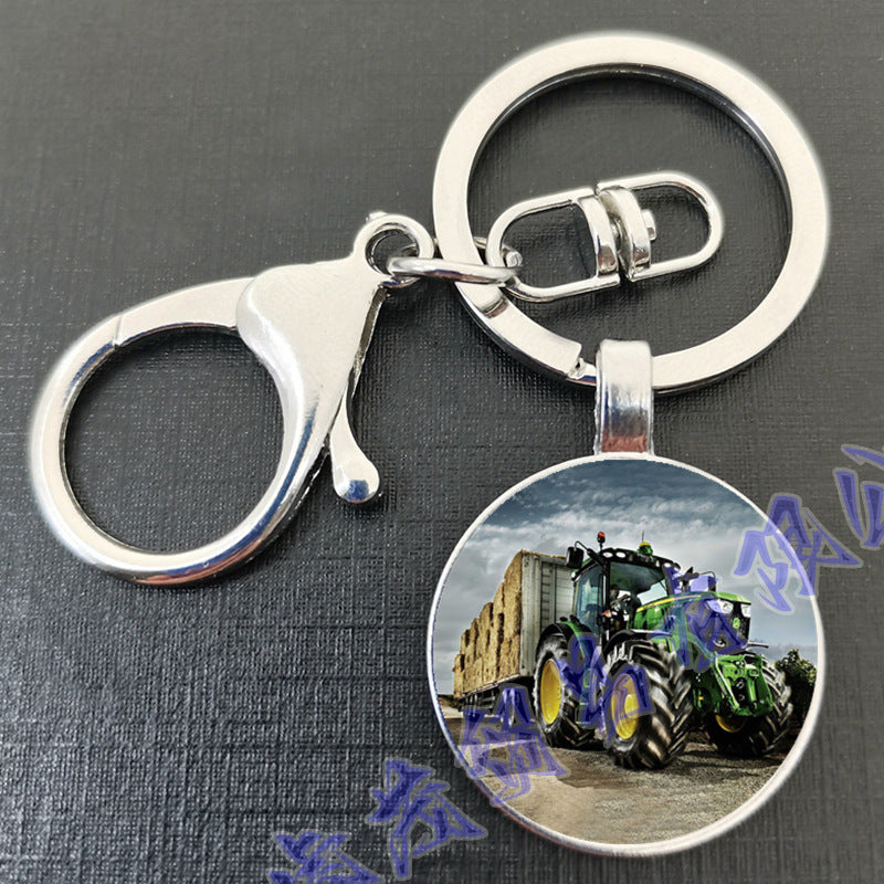 卸売タイムジェムトラクターラウンドガラスメタルキーホルダー