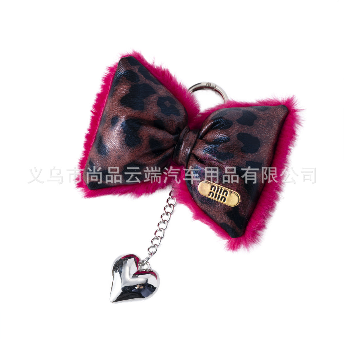 Wholesale ins light luxury leopard leather cotton-filled bow heart keychain niche design hot girl sweet cool mobile phone chain