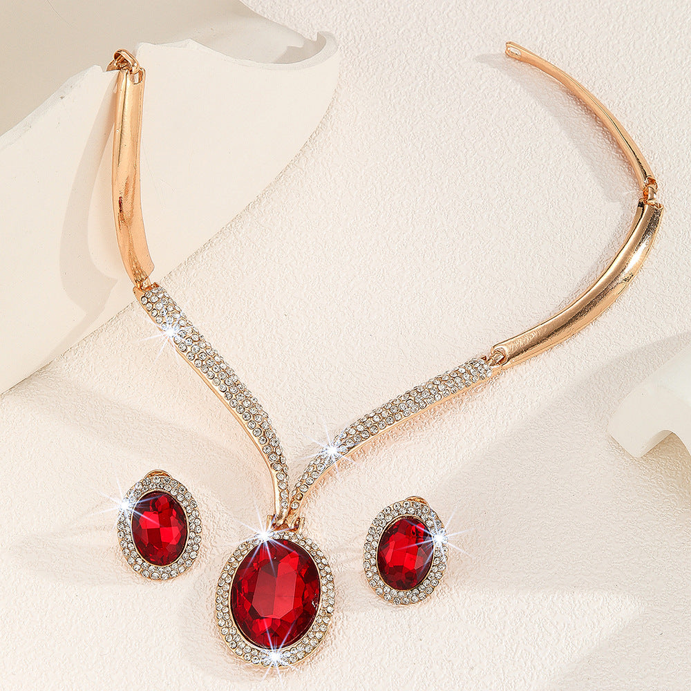 Wholesale gold zinc alloy inlaid white rhinestone red crystal necklace earrings suit women jewelry