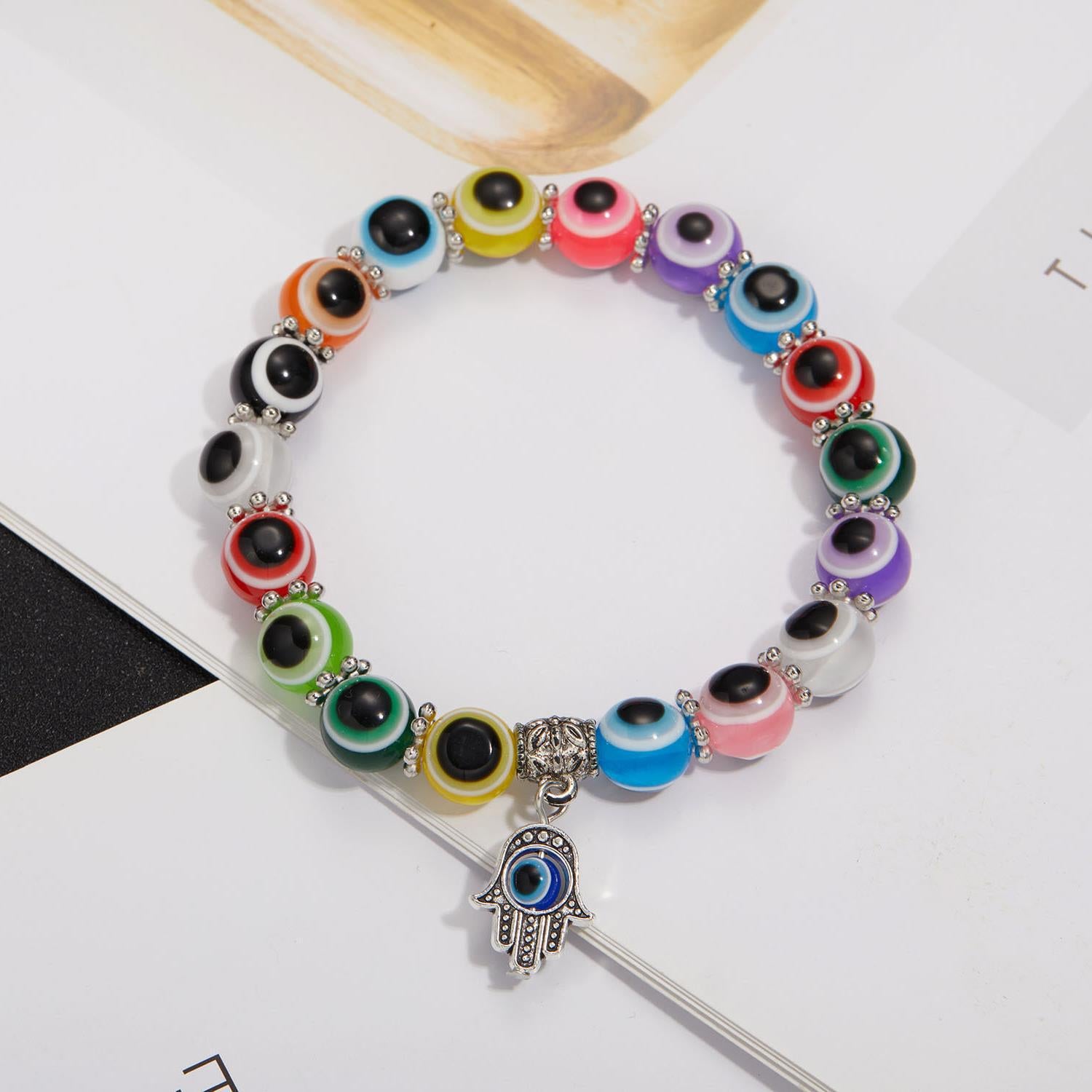 Wholesale alloy palm hollow blue eyes beaded pendant elastic bracelet Charms