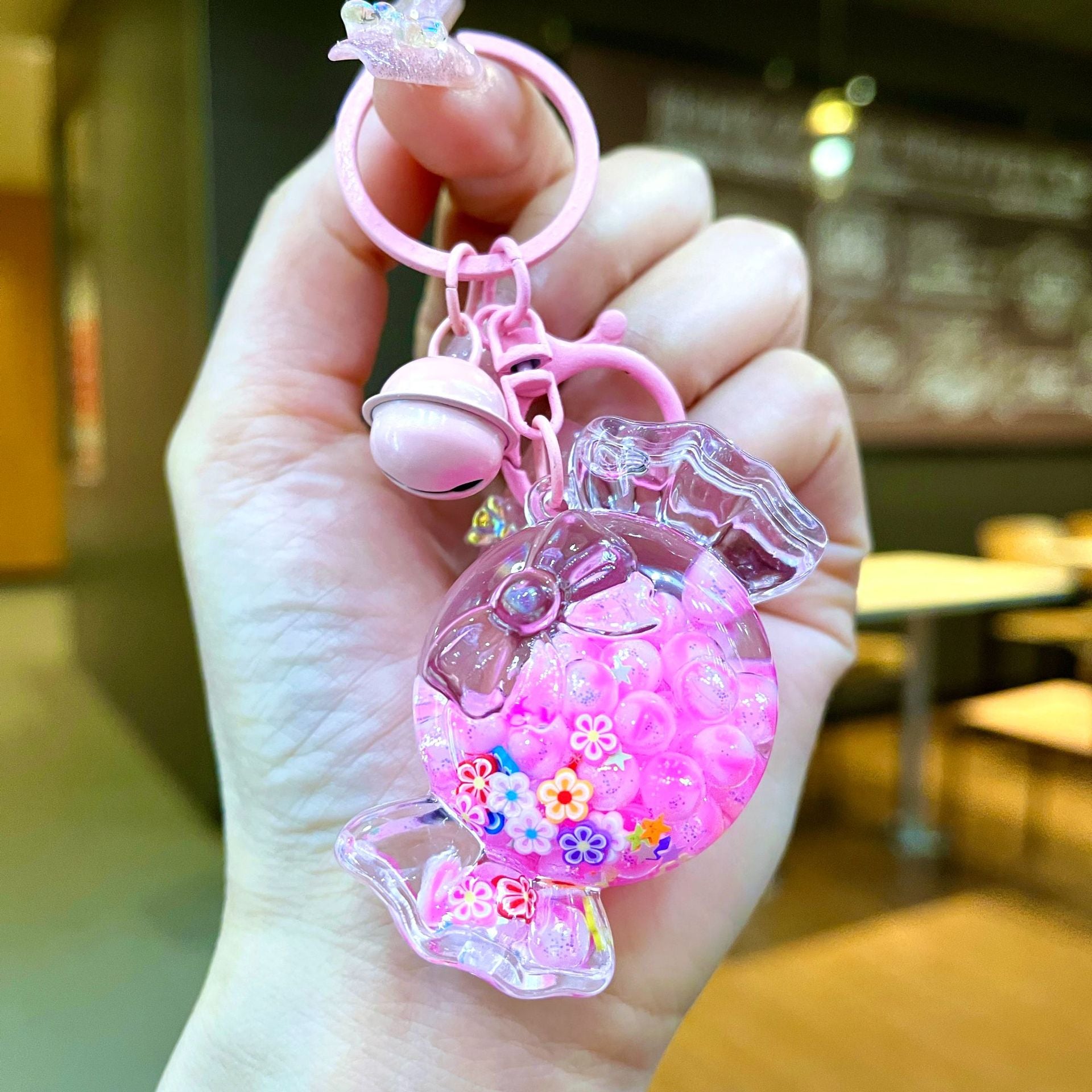 Wholesale Oil filled luminous colorful candy quicksand bottle keychain