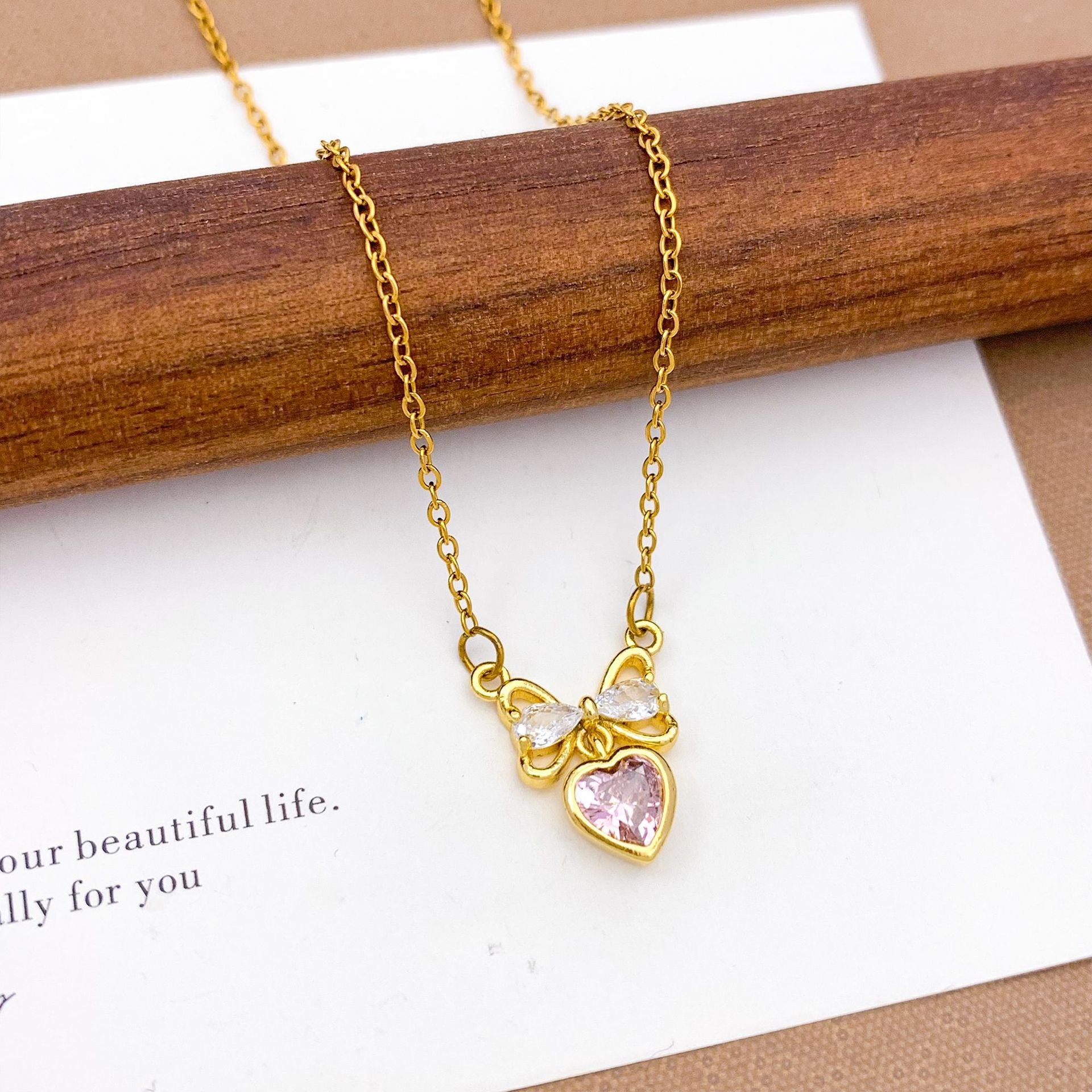 Wholesale Pink heart-shaped bow with diamond studded titanium steel necklace