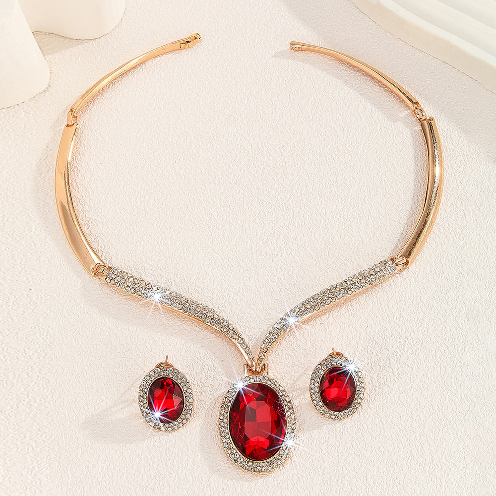 Wholesale gold zinc alloy inlaid white rhinestone red crystal necklace earrings suit women jewelry