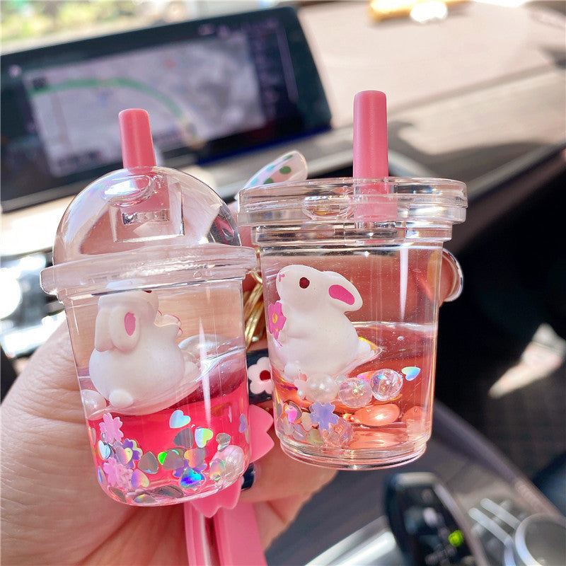 Wholesale Cherry Blossom Bunny Into Oil Milk Tea Cup Floating Bottle Acrylic Keychain
