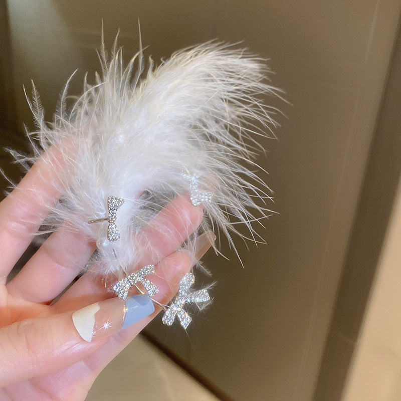 Wholesale Diamond studded bow feather tassel earrings