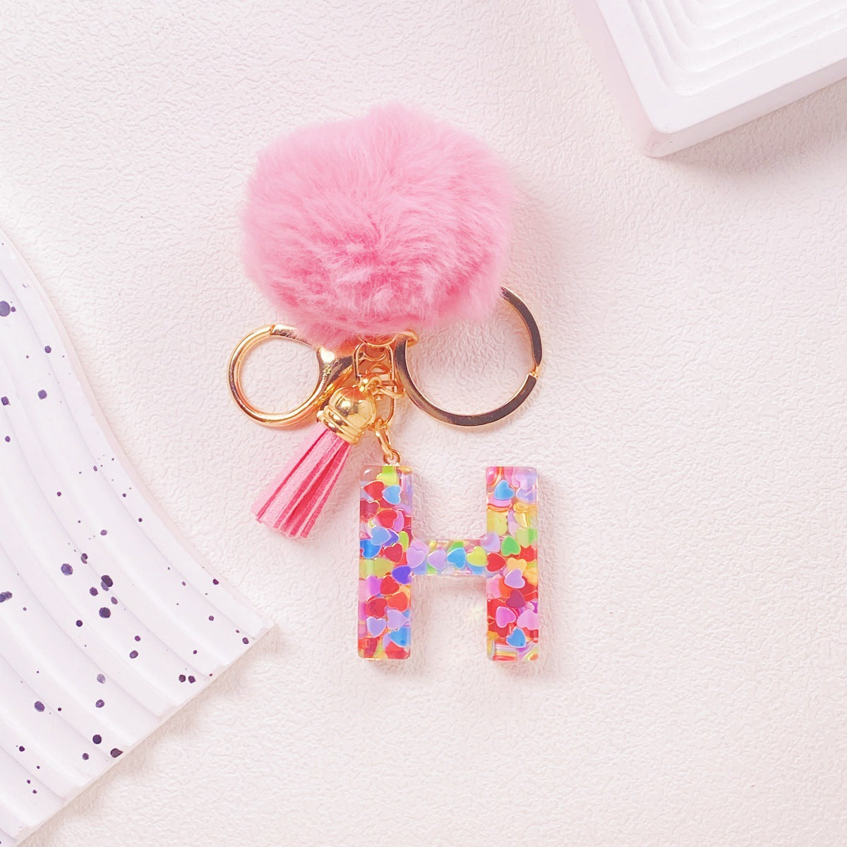 Wholesale Hairball English 26 letter pink Pom Pom keychain
