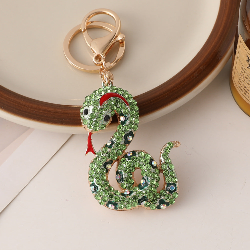 Wholesale Creative cartoon diamond twelve zodiac snake metal car keychain national tide this year pendant small gifts