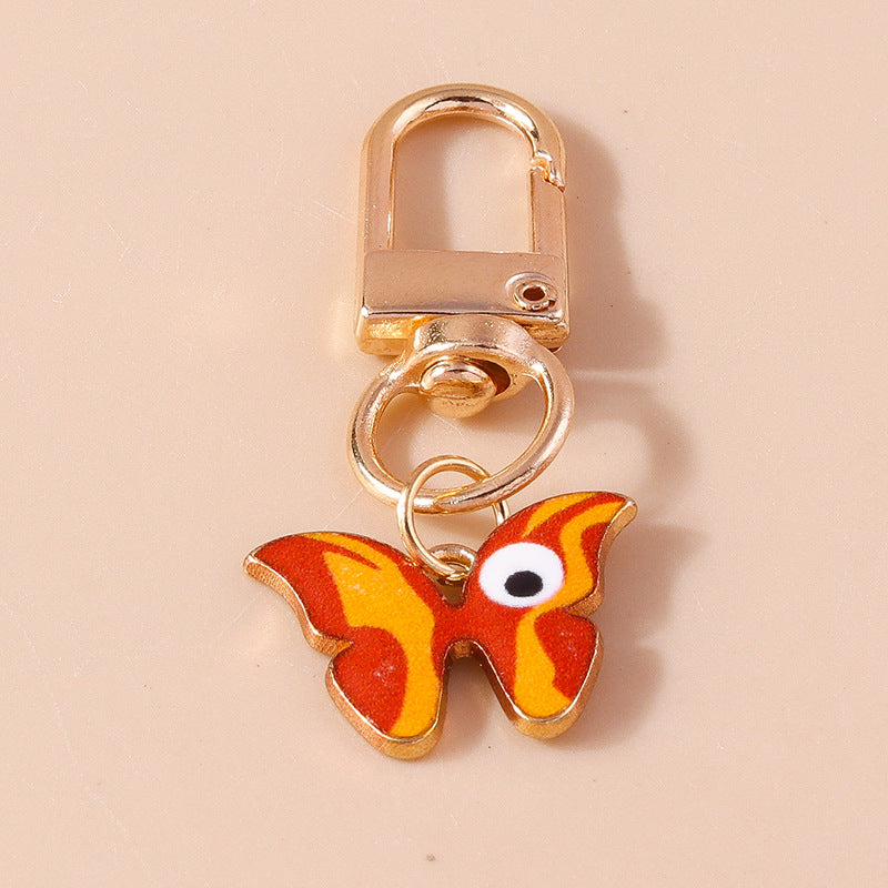 Wholesale Cartoon Butterfly Eyes Zinc Alloy Keychain