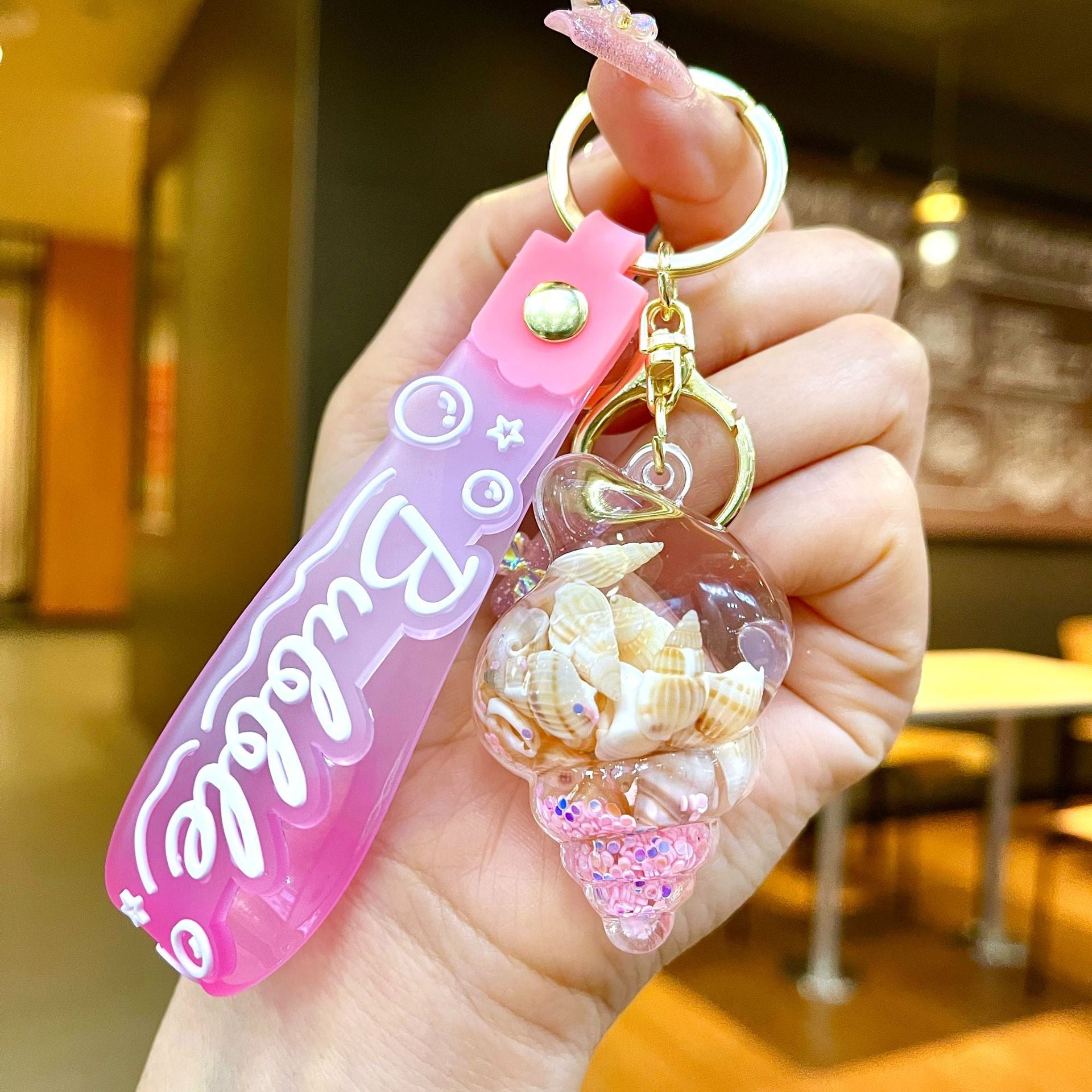 Wholesale Colorful flowing sand seashell DIY insert oil keychain