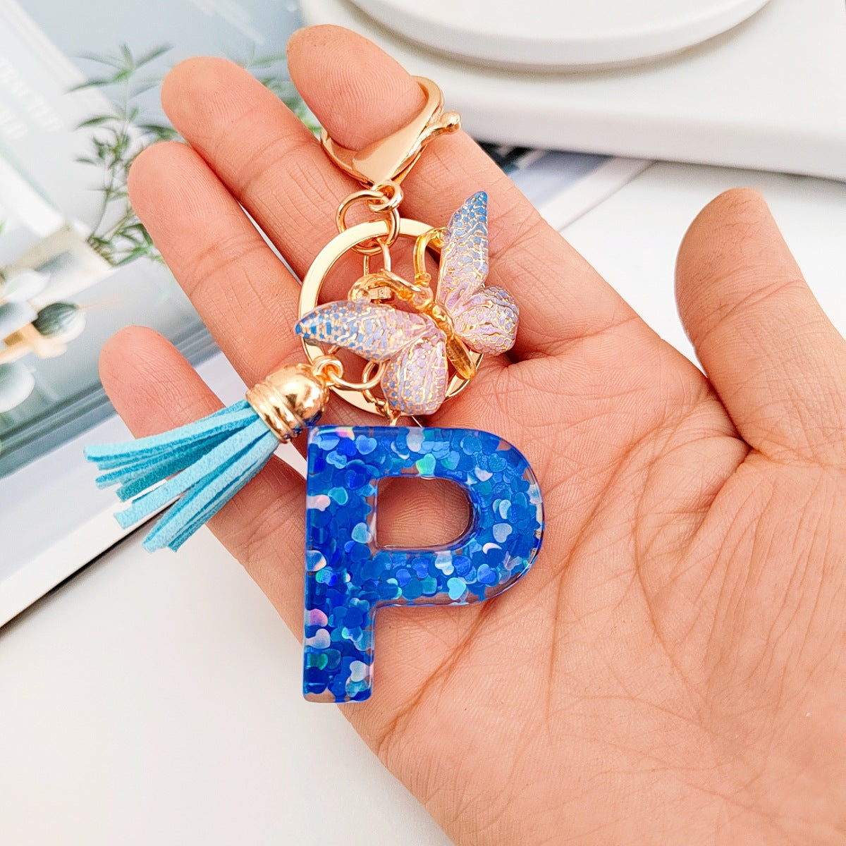 Wholesale blue crystal epoxy letter key chain pendant resin sequined butterfly key chain