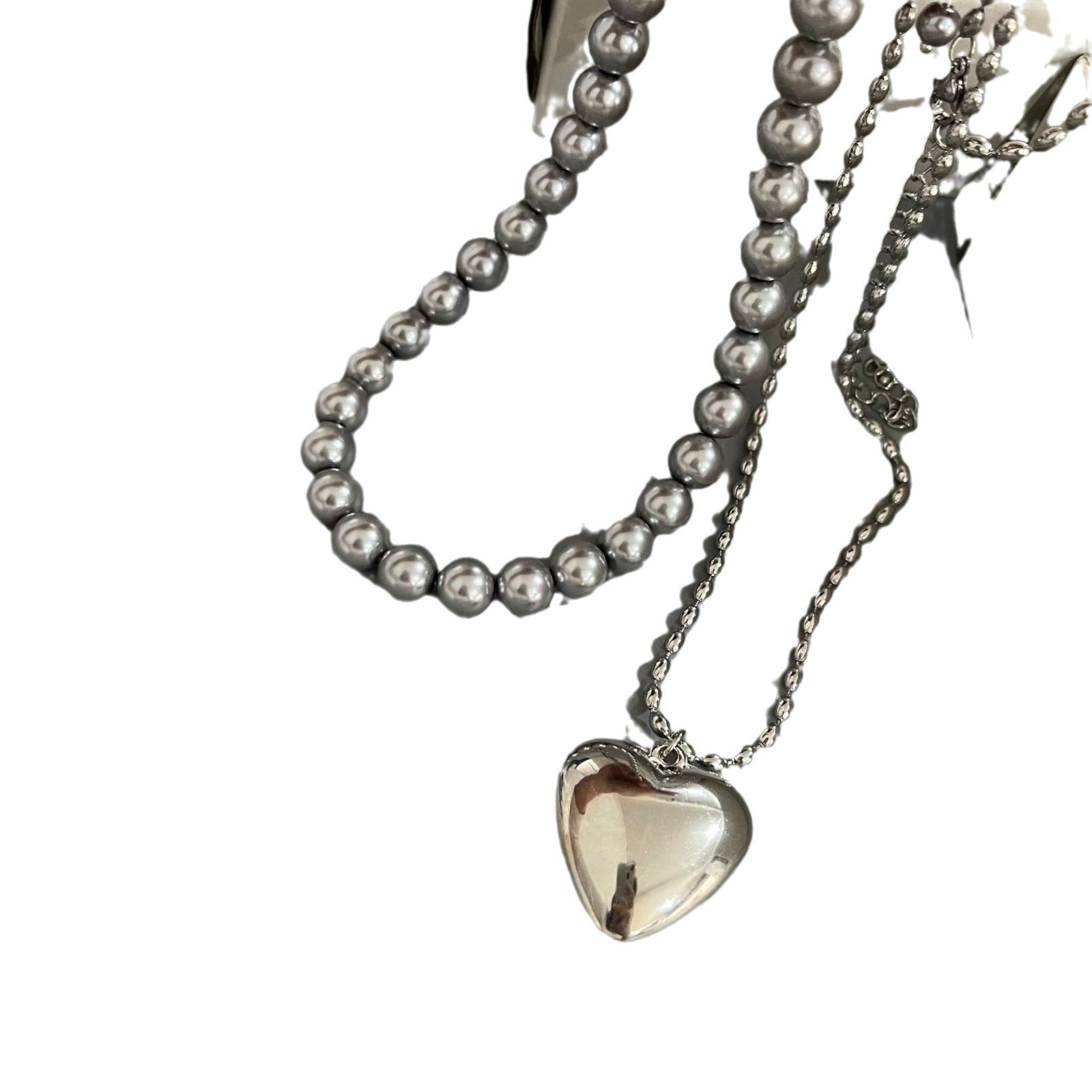 Wholesale Rice Bead Titanium Steel Necklace Hollow Heart Pendant Sweater Chain