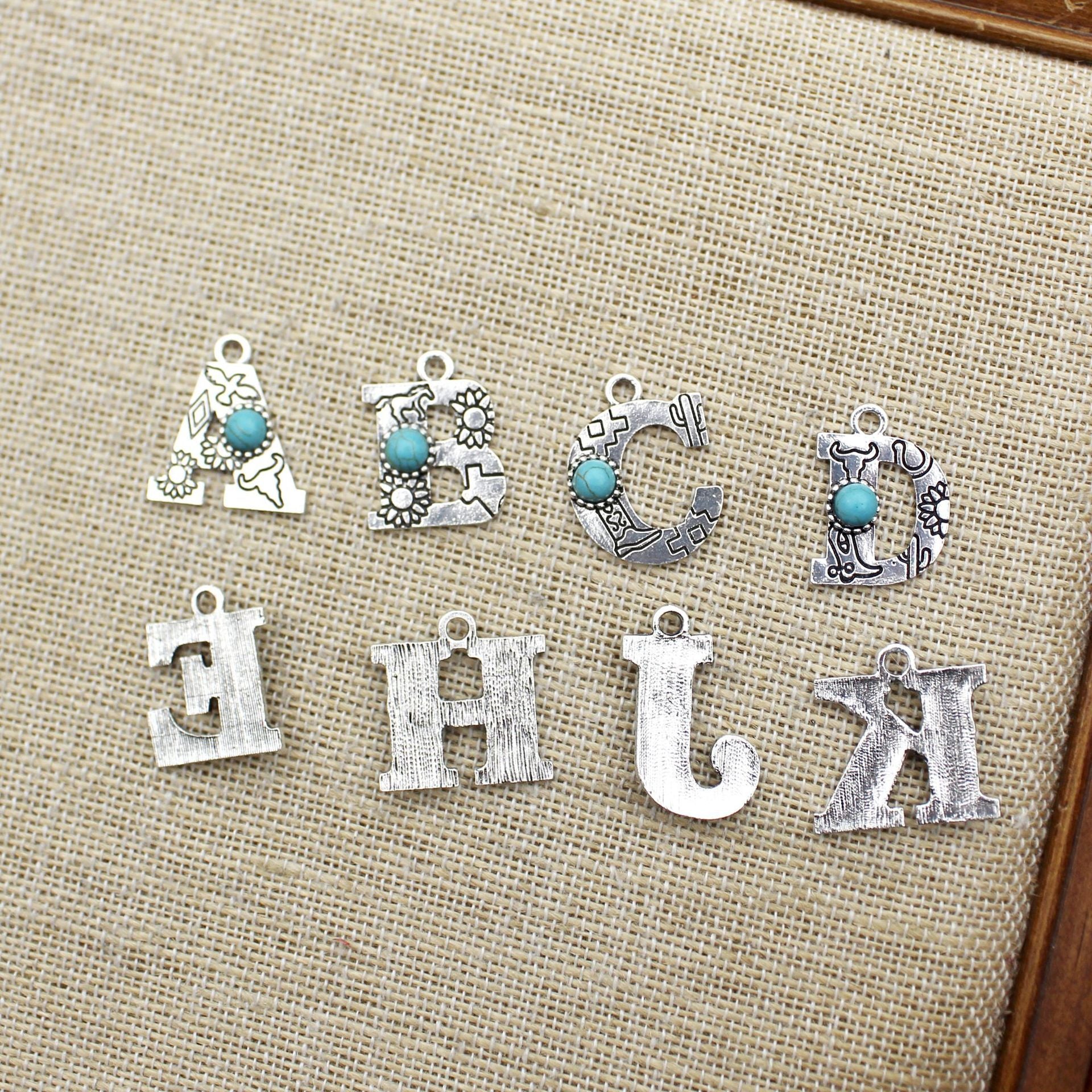 Wholesale of Western Wind Letter Natural Turquoise Alloy Letter Keychain Accessories