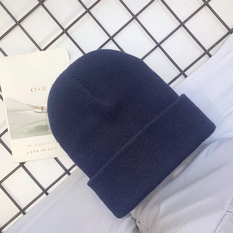Wholesale Acrylic plain solid color embroidered beanie windproof earmuffs warm knitted beanie to keep out the cold