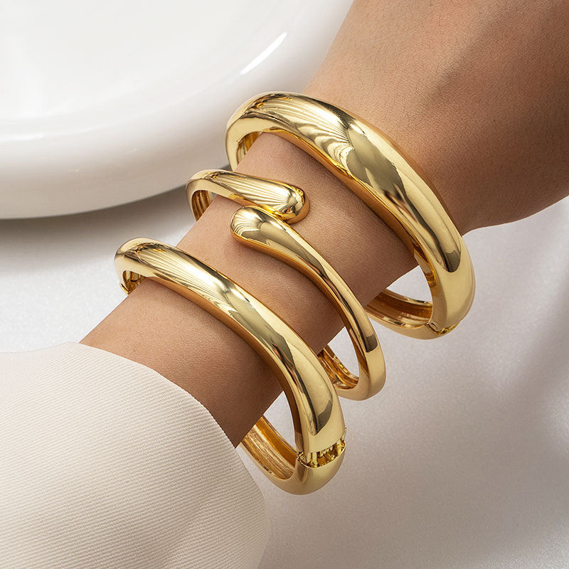 Wholesale Golden wide edged wave band exaggerated bracelet