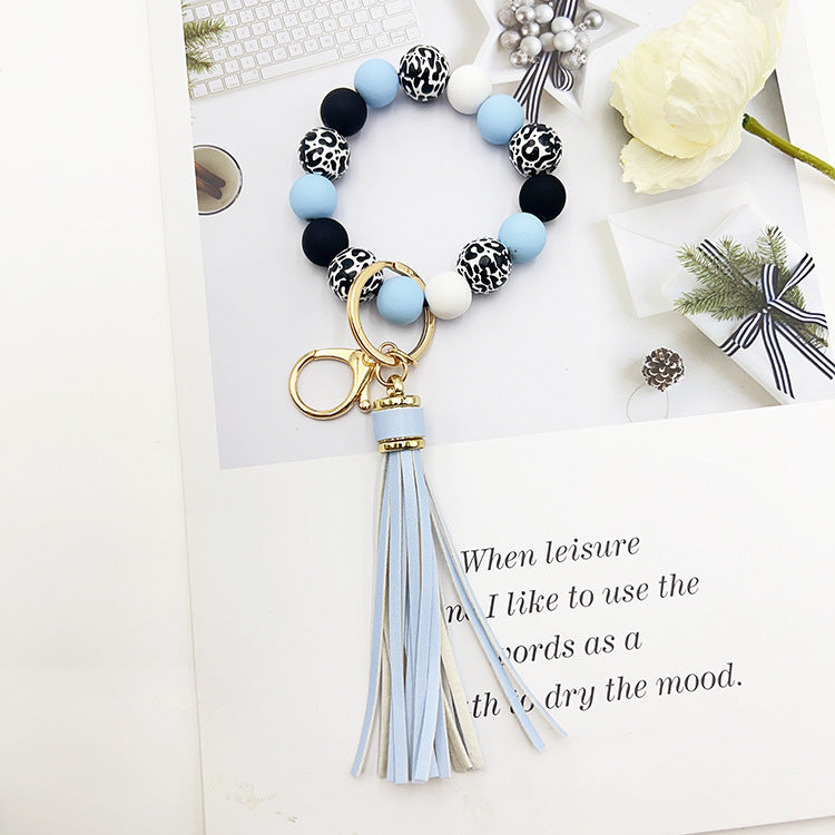 Wholesale Leopard Print White Bottom Wooden Beads Rubber Paint Round Beads PU Tassel Bracelet Keychain