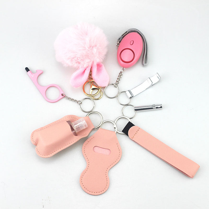 Wholesale Outdoor Whistle Hand Sanitizer Leather Case Fur Ball Key Chain Set