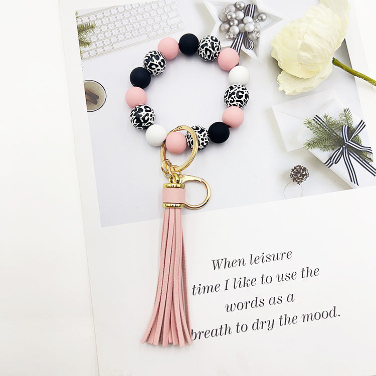 Wholesale Leopard Print White Bottom Wooden Beads Rubber Paint Round Beads PU Tassel Bracelet Keychain