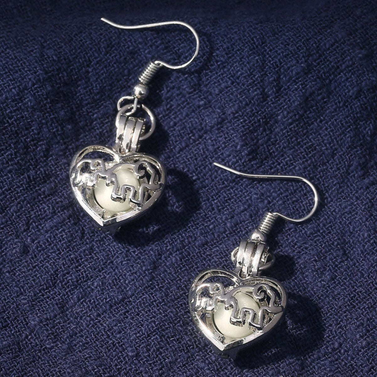 Wholesale Animal elephant baby elephant love hollow luminous earrings